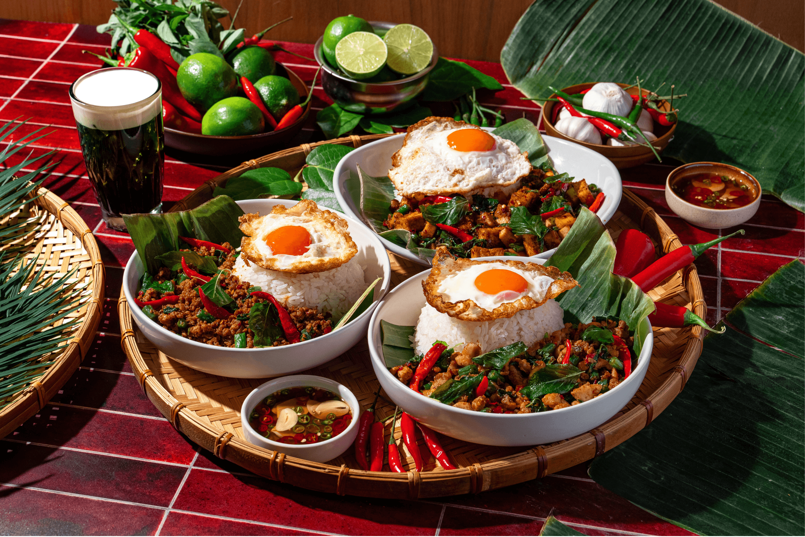 Holy Heat's Pad Kra Pow dishes featuring pork, chicken, and tofu & mushroom.